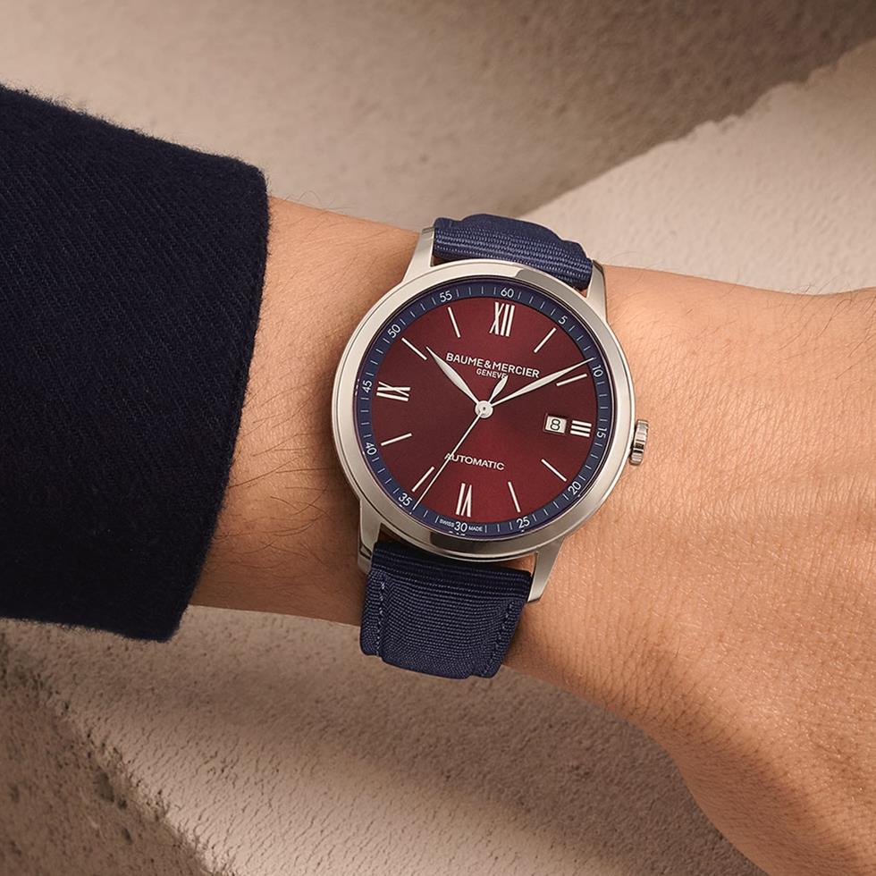 CLASSIMA ACCIAIO, AUTOMATICO, CASSA 42 MM, QUADRANTE BORGOGNA, CINTURINO TELA BLU - BAUME & MERCIER